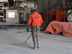 Worker sweeping at MountainWest PreCast wearing the DustCount 8899